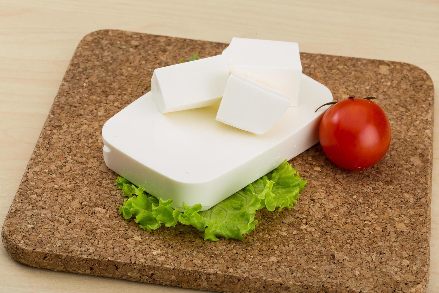 Feta cheese on wood photo