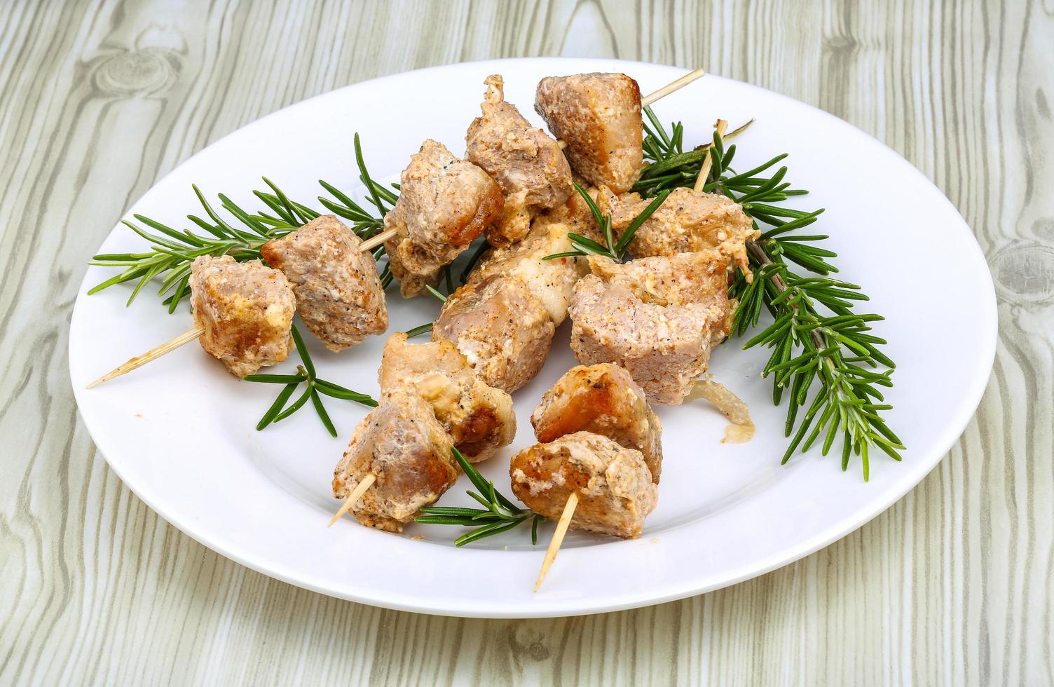 Chicken skewers on plate photo
