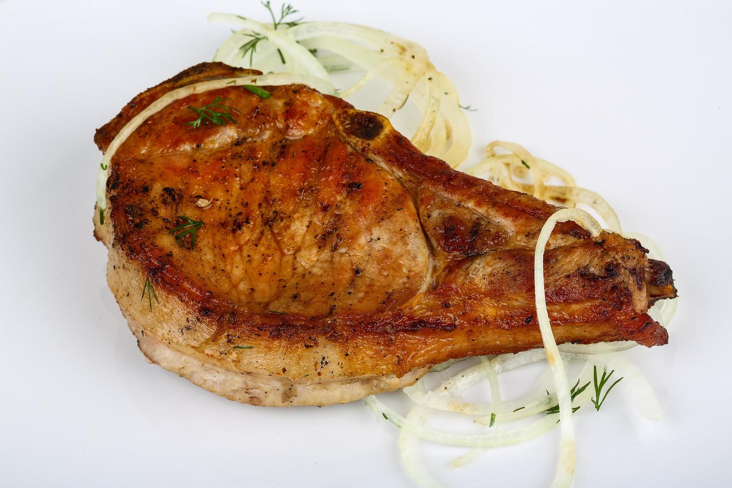 Grilled pork on wood photo