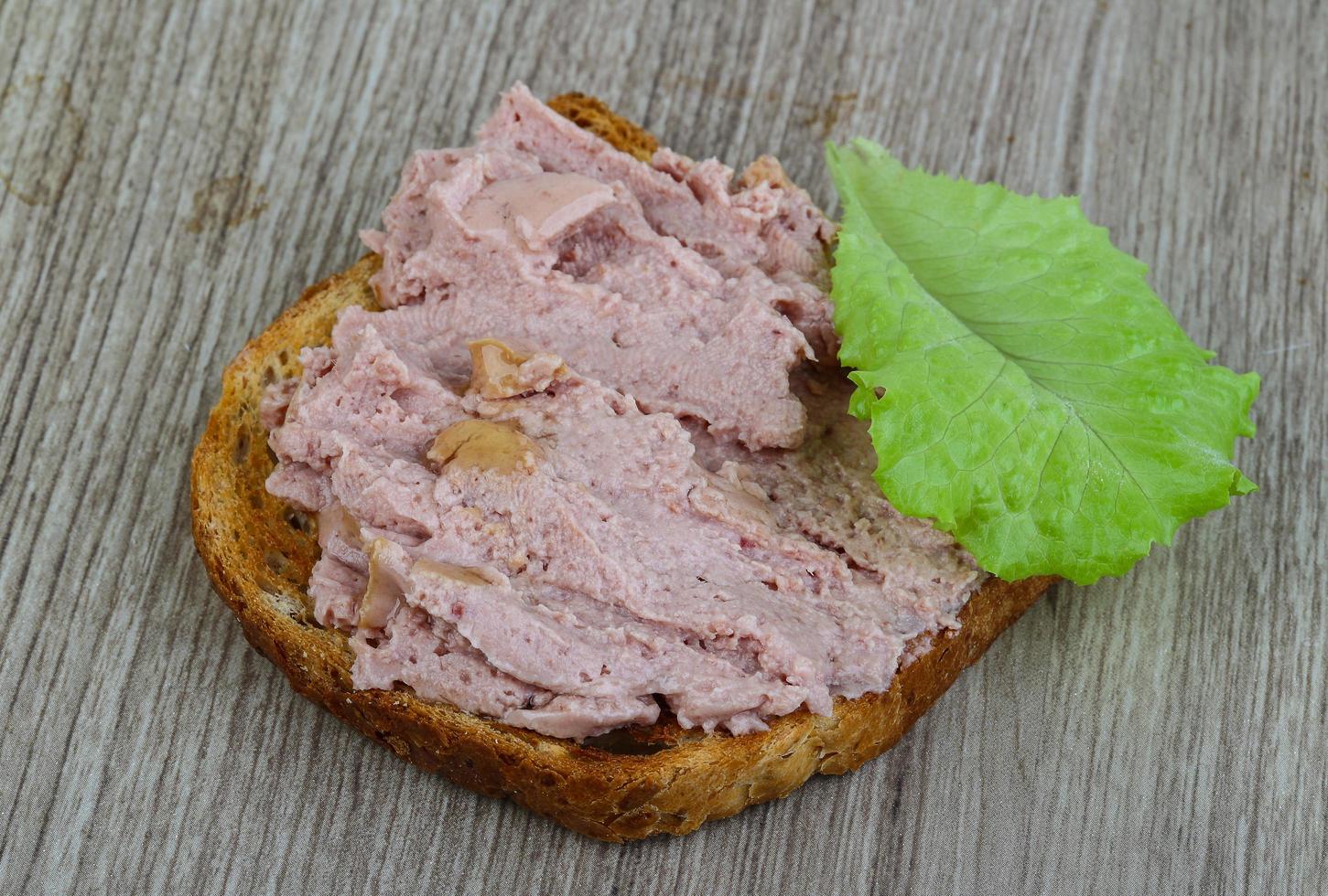 Pate sandwich on wood photo