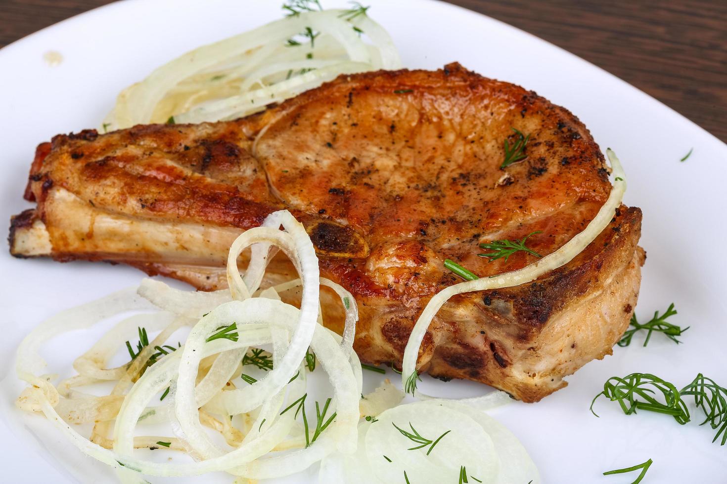Grilled pork on wood photo