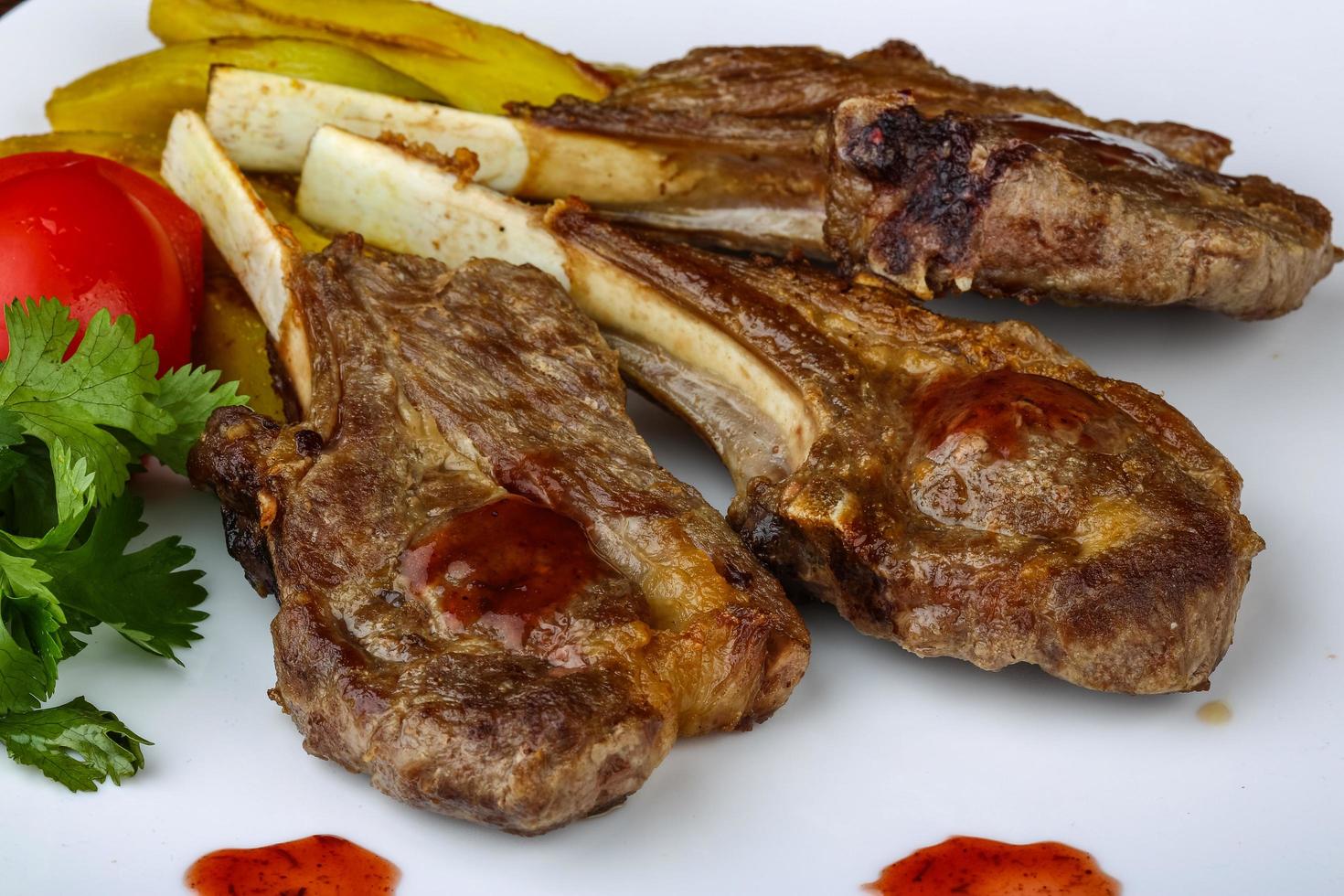 Lamb chops on wood photo