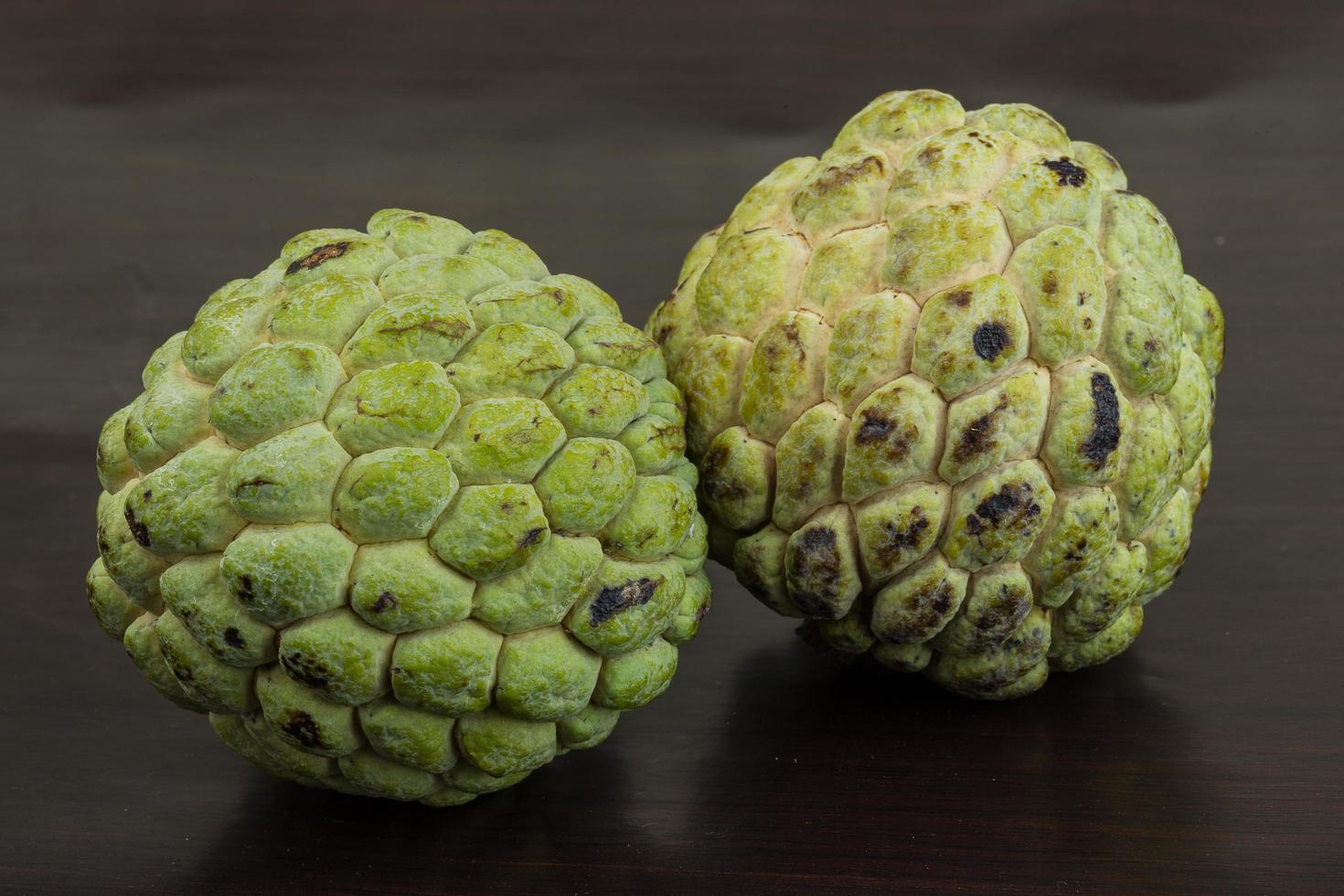 Custard apple on black background photo