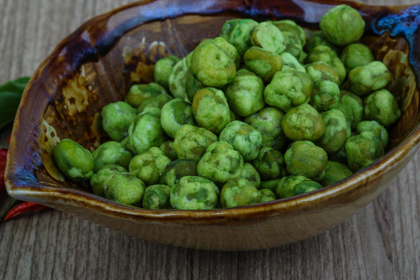 Wasabi peas on wood photo