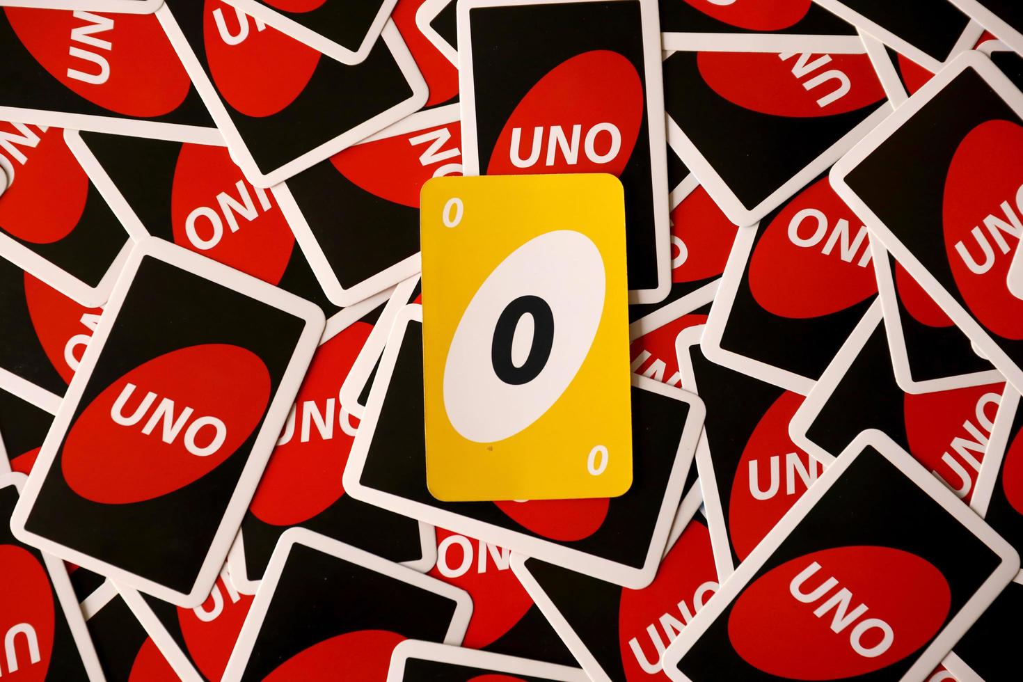 TERNOPIL, UKRAINE - MAY 15, 2022 Many colorful UNO game cards. UNO is an American shedding-type card game that is played with a specially printed deck photo
