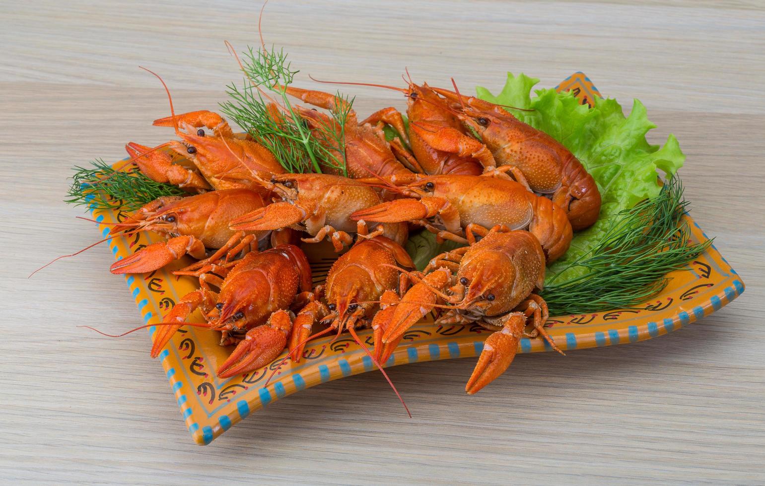 Boiled crayfish on wood photo