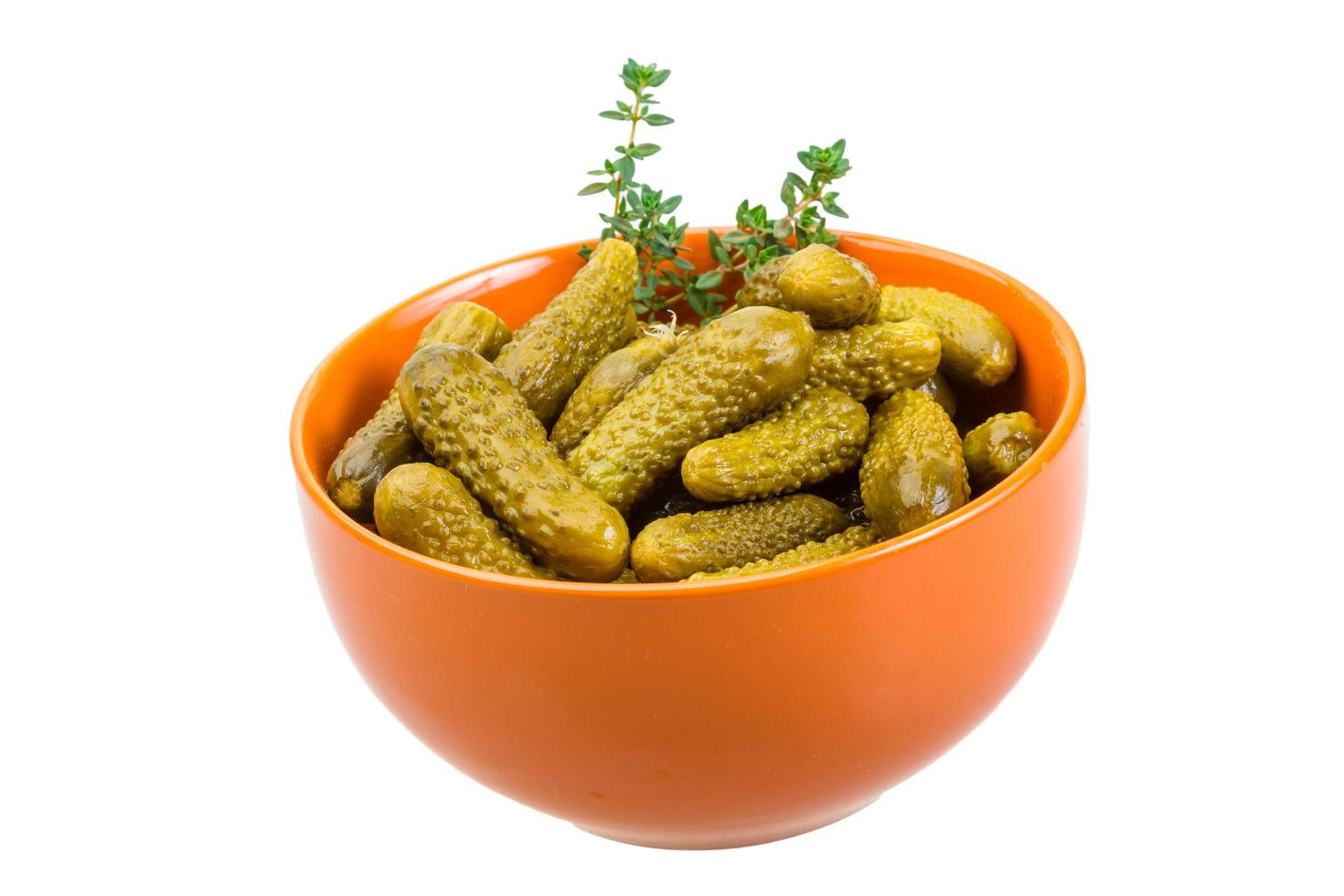 Marinated cucumbers on white photo