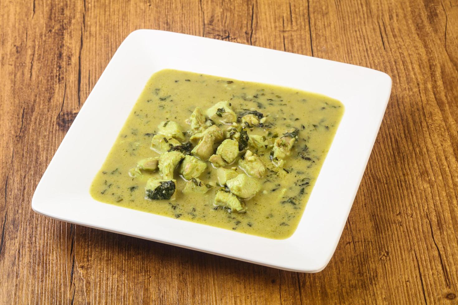 Green Curry on wood photo