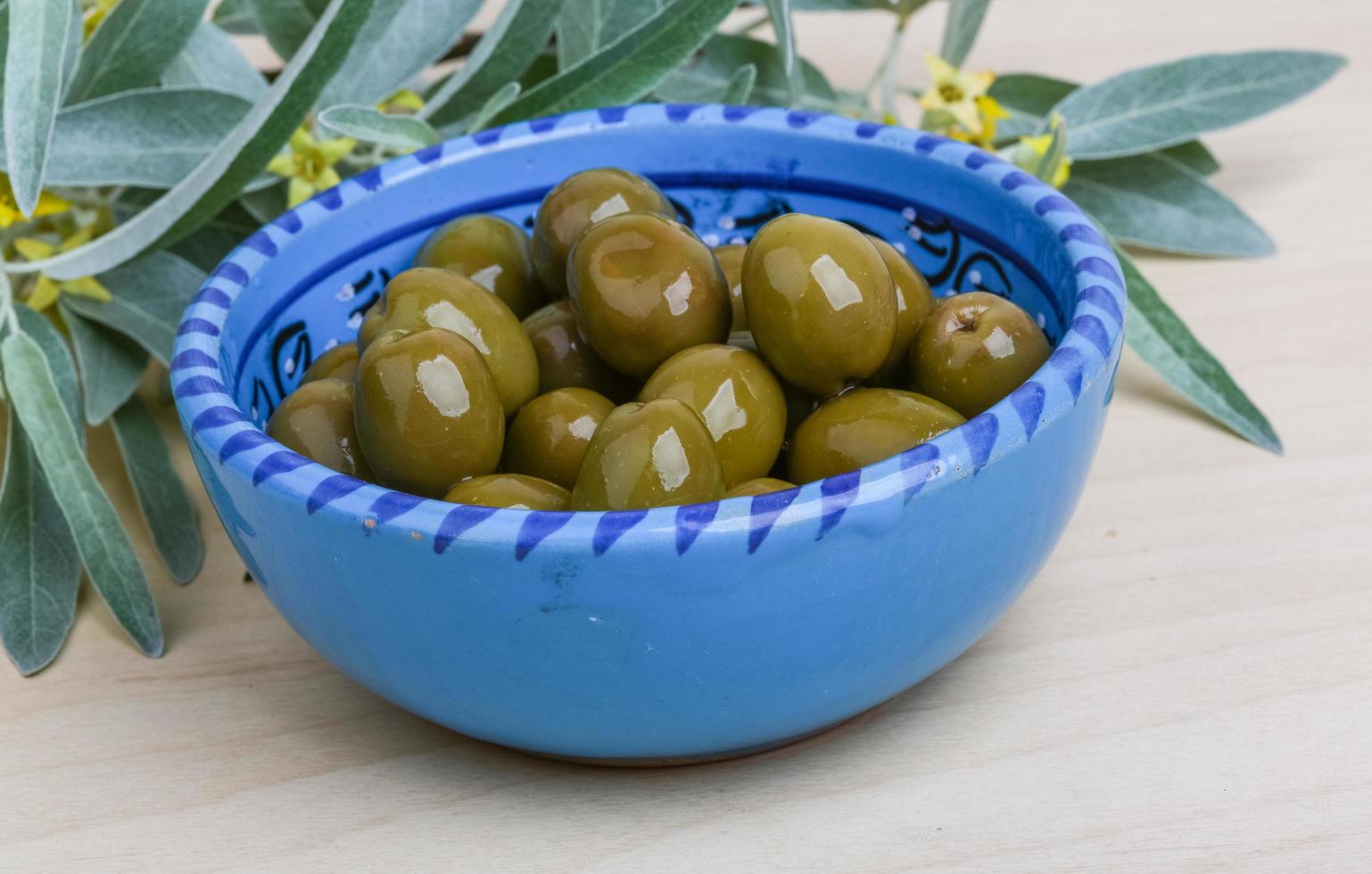 Green olives dish 12772569 Stock Photo at Vecteezy