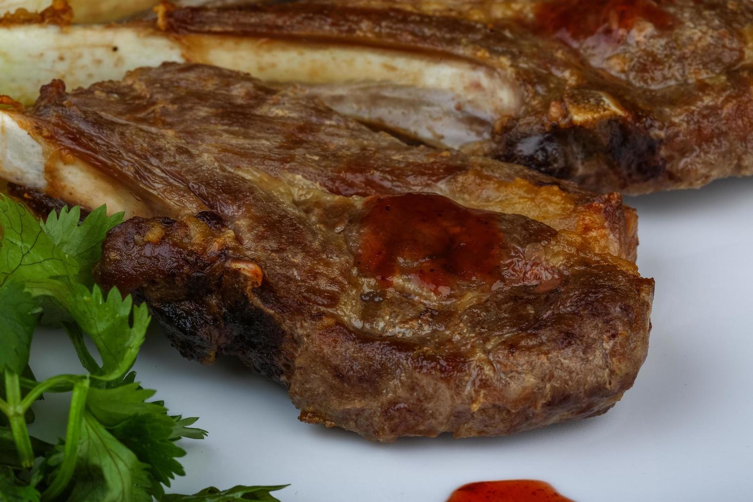 Lamb chops on wood photo