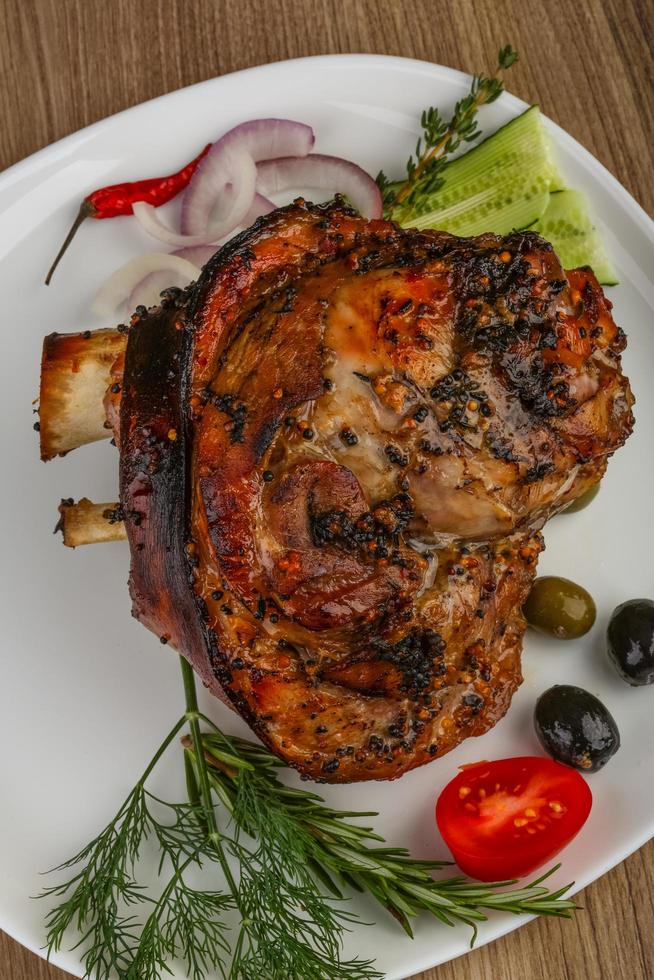 Pork knee on wood photo