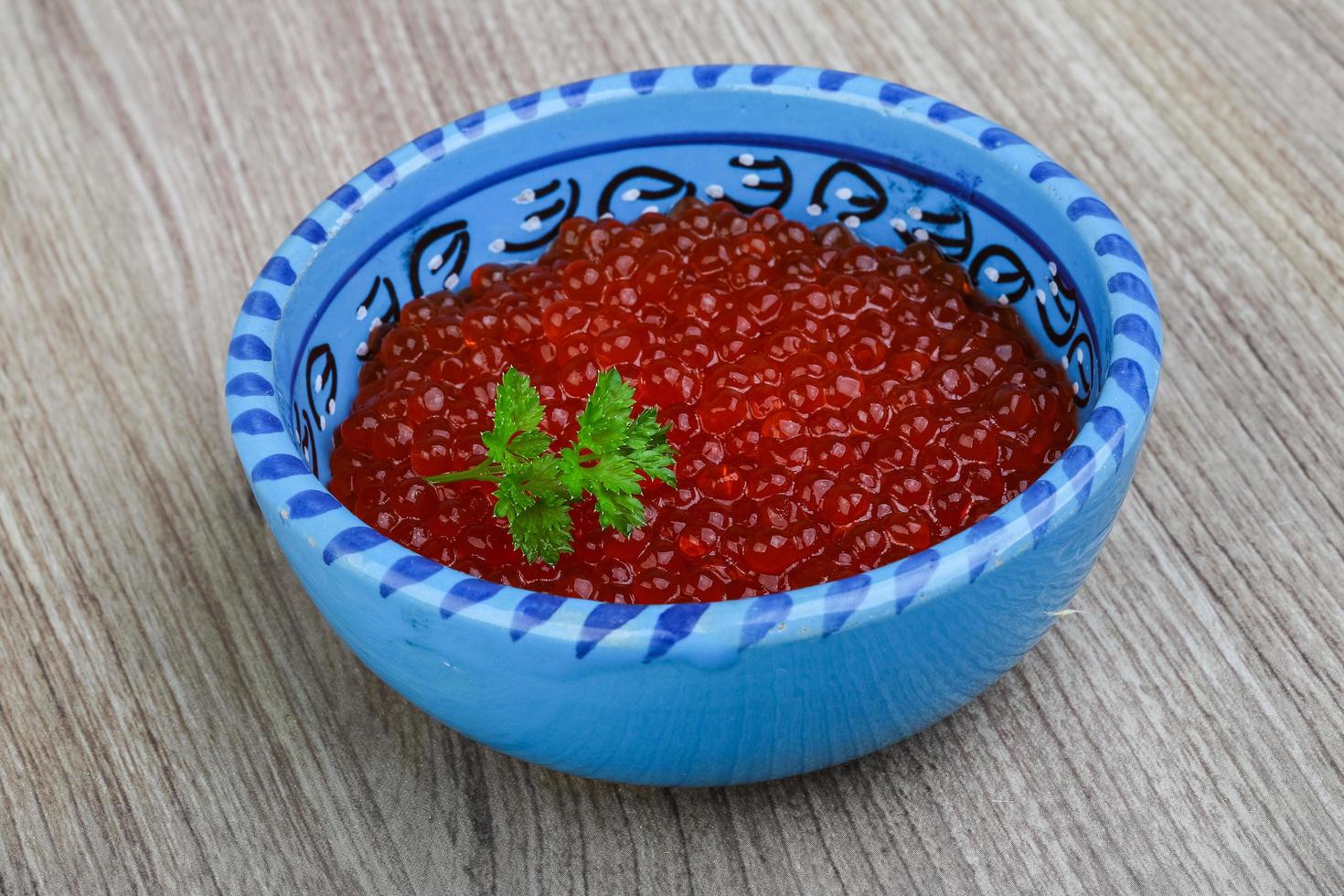 Red caviar on wood photo