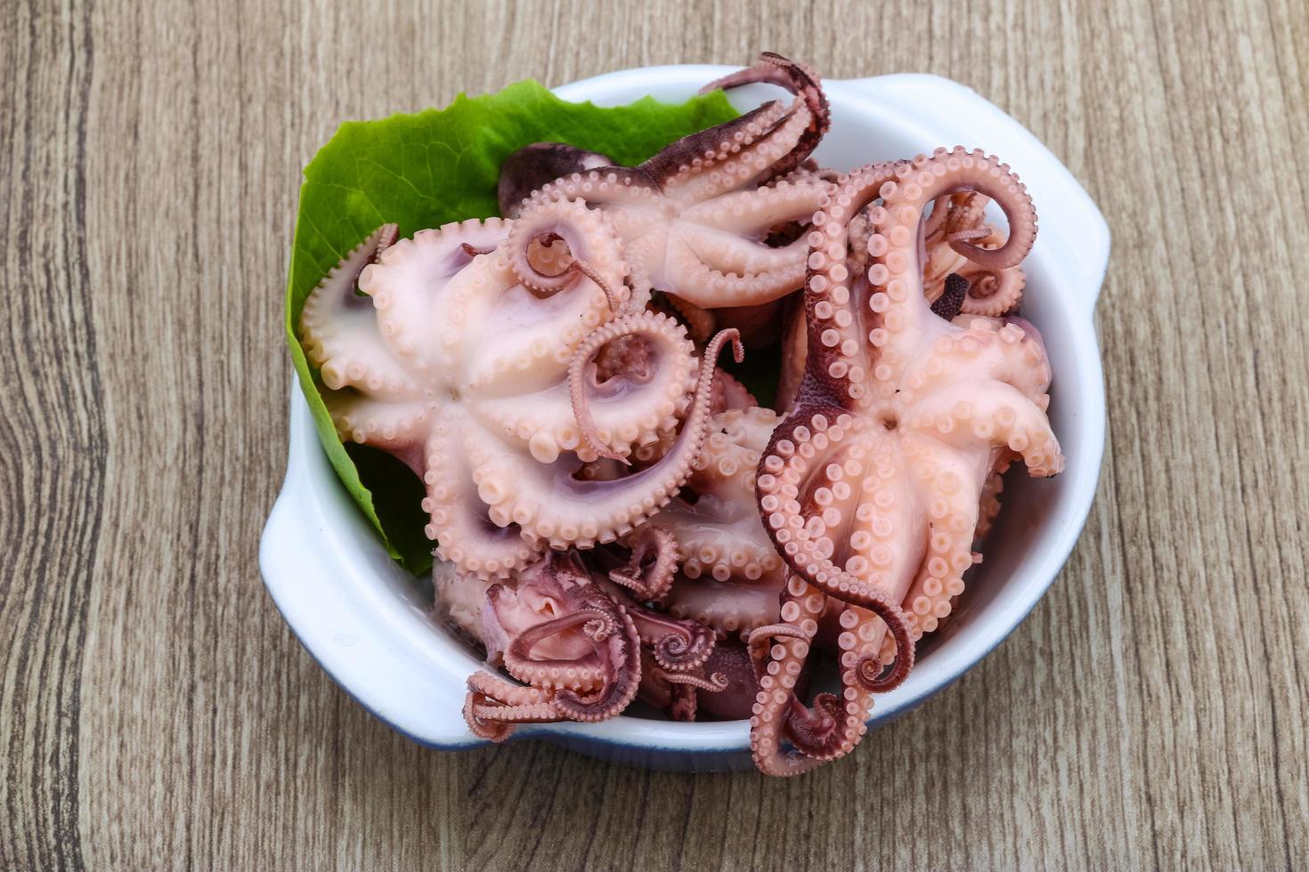 Marinated octopus on wood photo