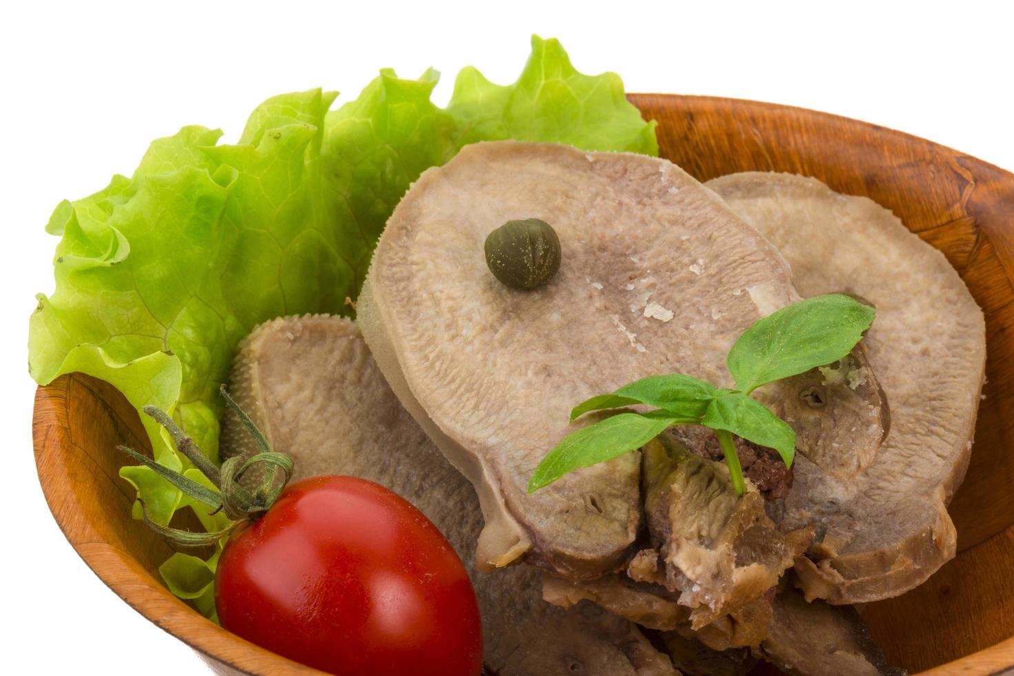 Beef tongue on white photo
