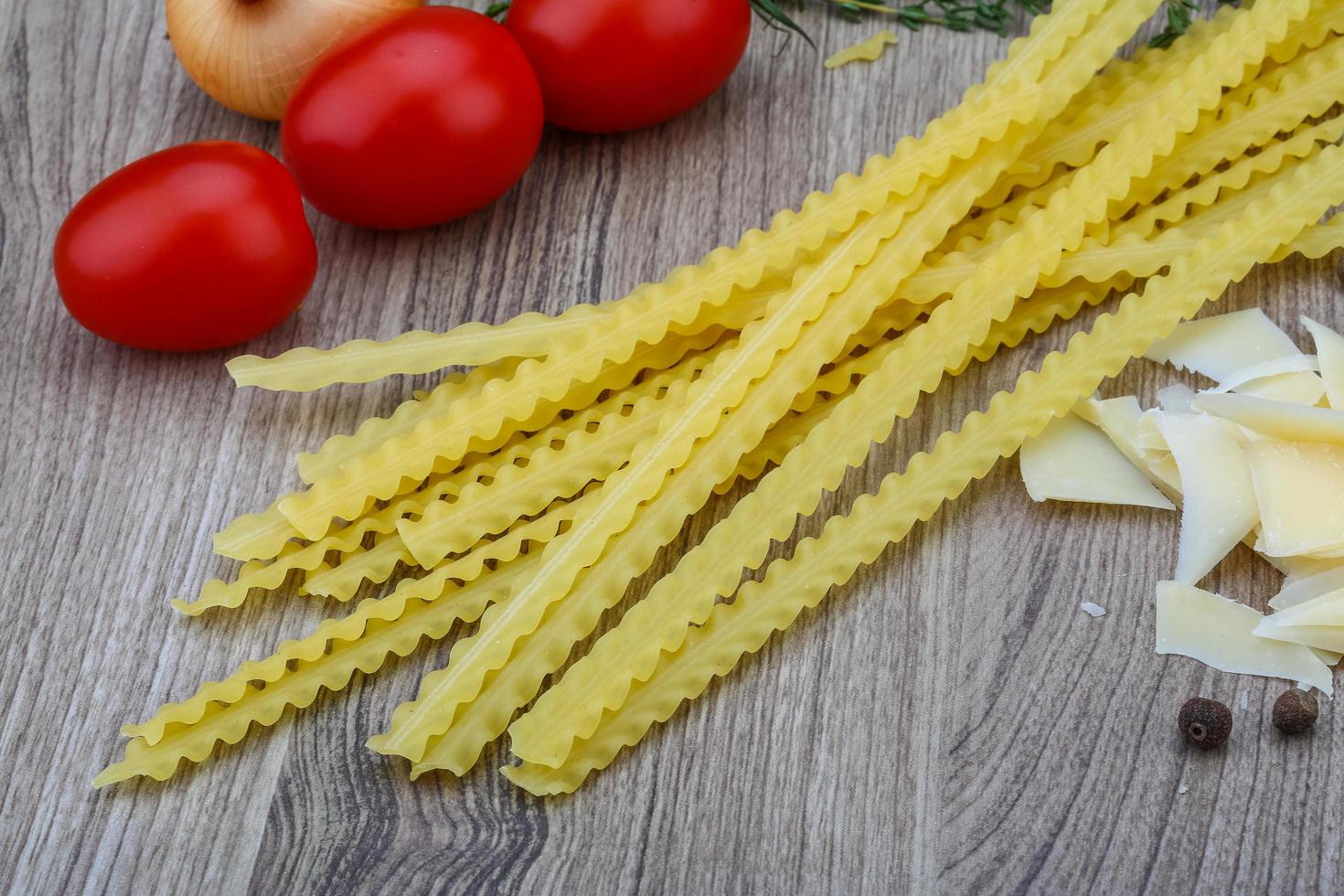 Mafalde pasta on wood 12773327 Stock Photo at Vecteezy