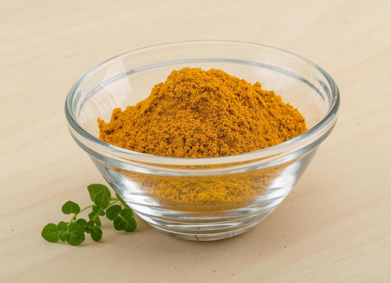 Curry powder on wood photo
