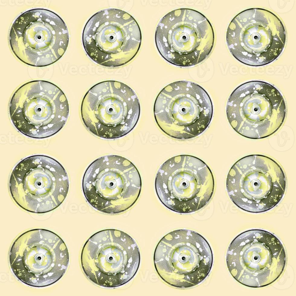Many used spray cans for graffiti drawing lies on a pastel colored backgroung. Street art painting concept. Minimal flat lay pattern. Top view photo