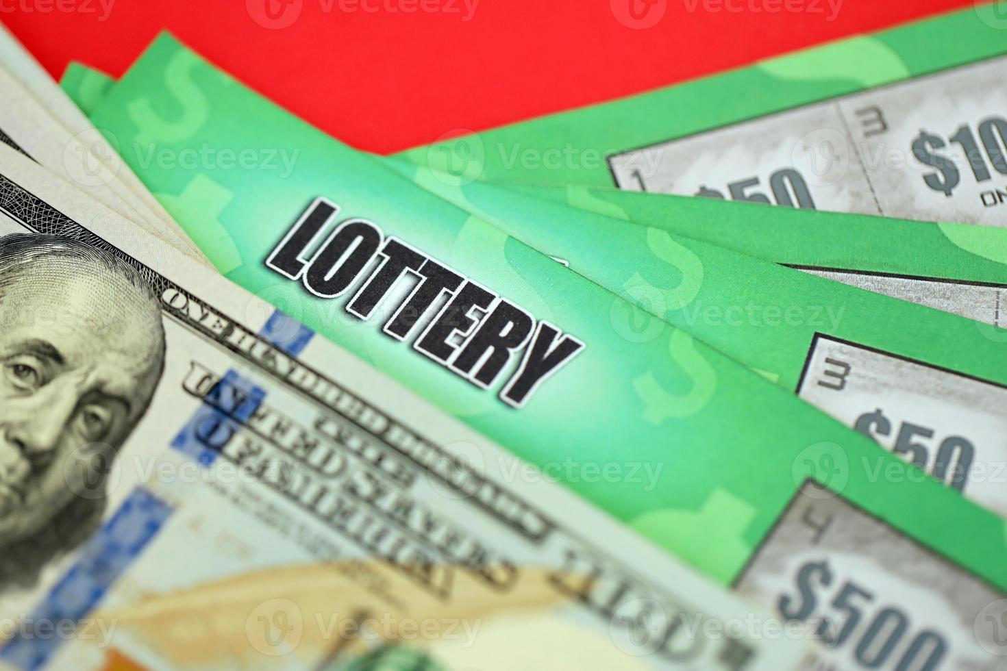 Close up view of green lottery scratch cards and us dollar bills. Many used fake instant lottery tickets with gambling results. Gambling addiction photo