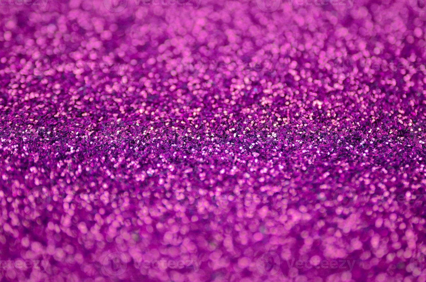Pink decorative sequins. Background image with shiny bokeh lights from small elements photo