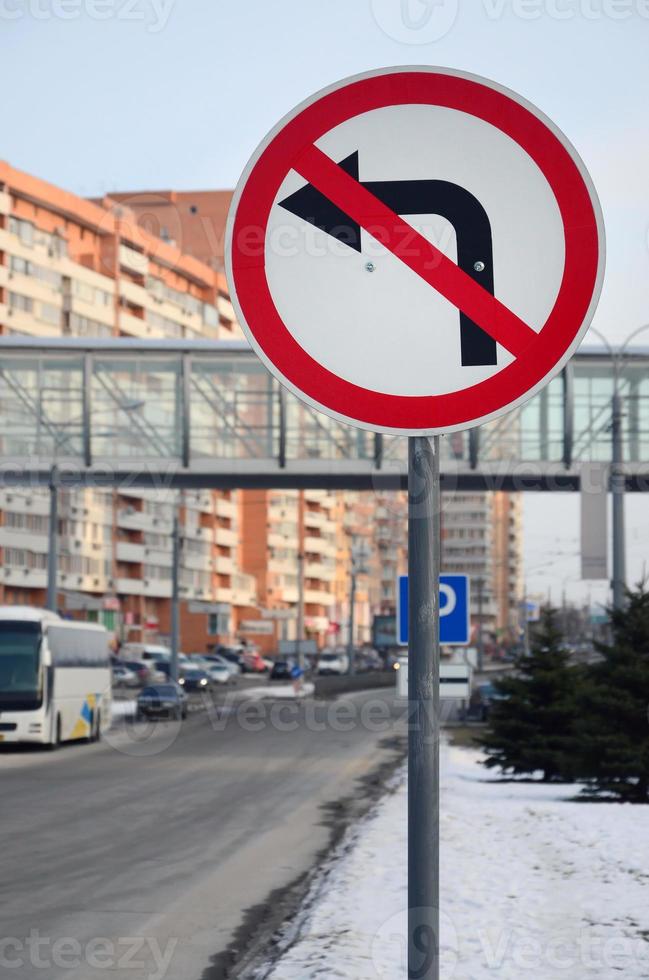 Turn left is prohibited. Traffic sign with crossed out arrow to the left photo