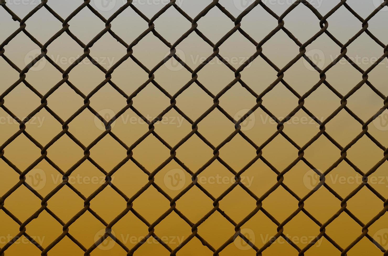 Texture of an old and rusty metal mesh on a neutral colored background photo