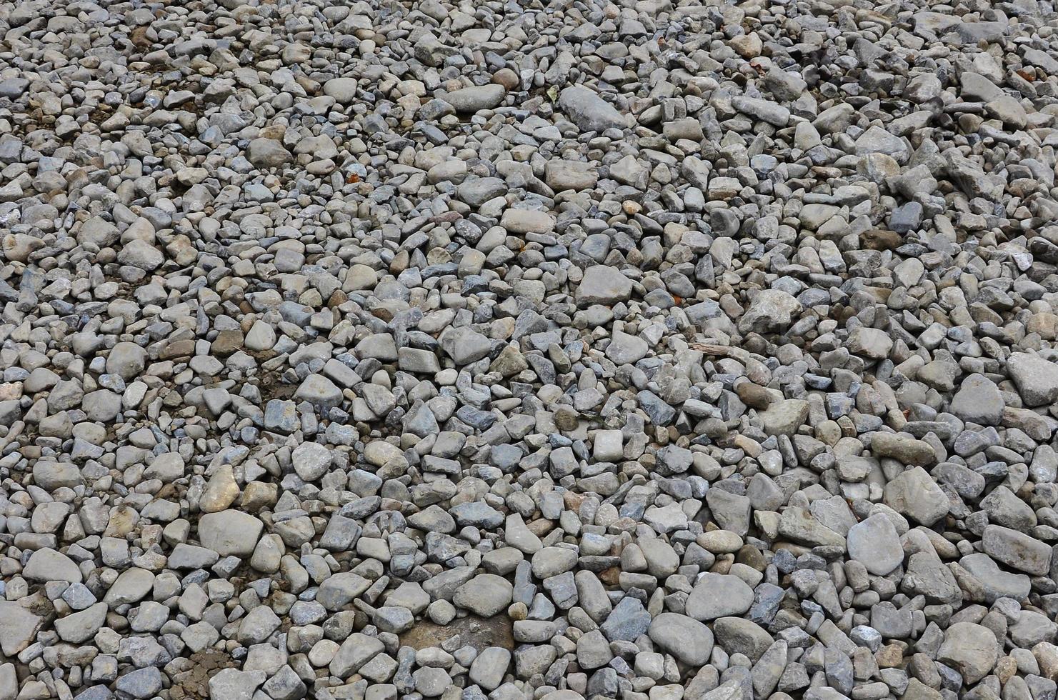 Texture of many crushed stones. Crushed stone is a solid base material for foundation photo