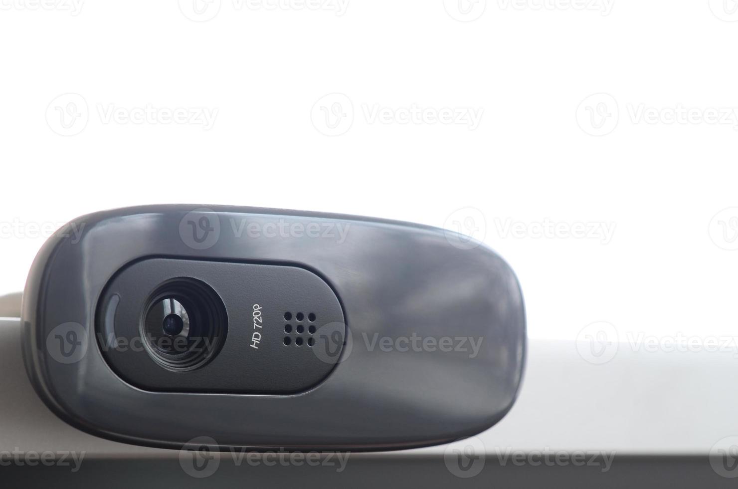 A modern web camera is installed on the body of a flat screen monitor. Device for video communication and recording of high quality video photo