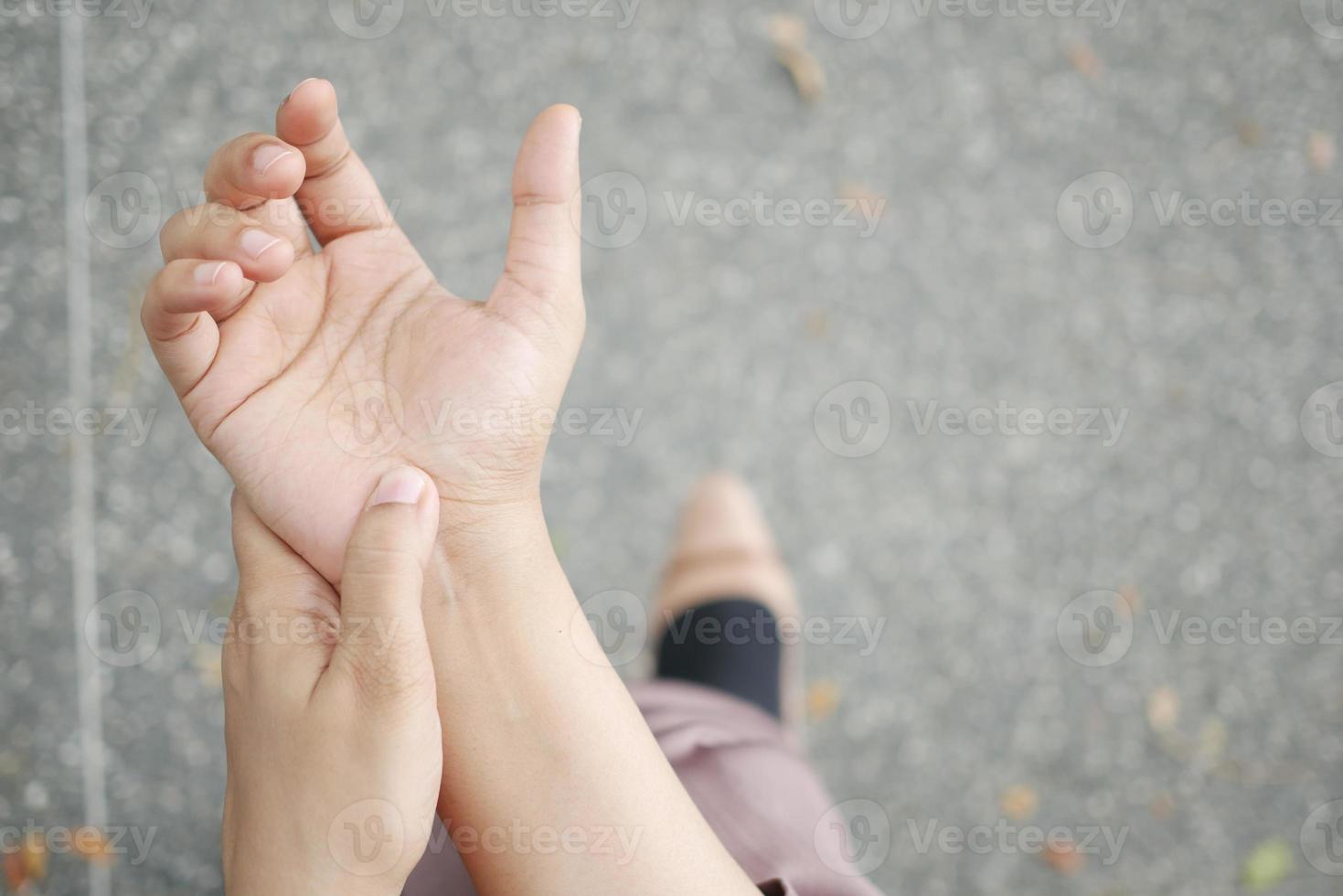 Young women hands suffering wrist pain, photo