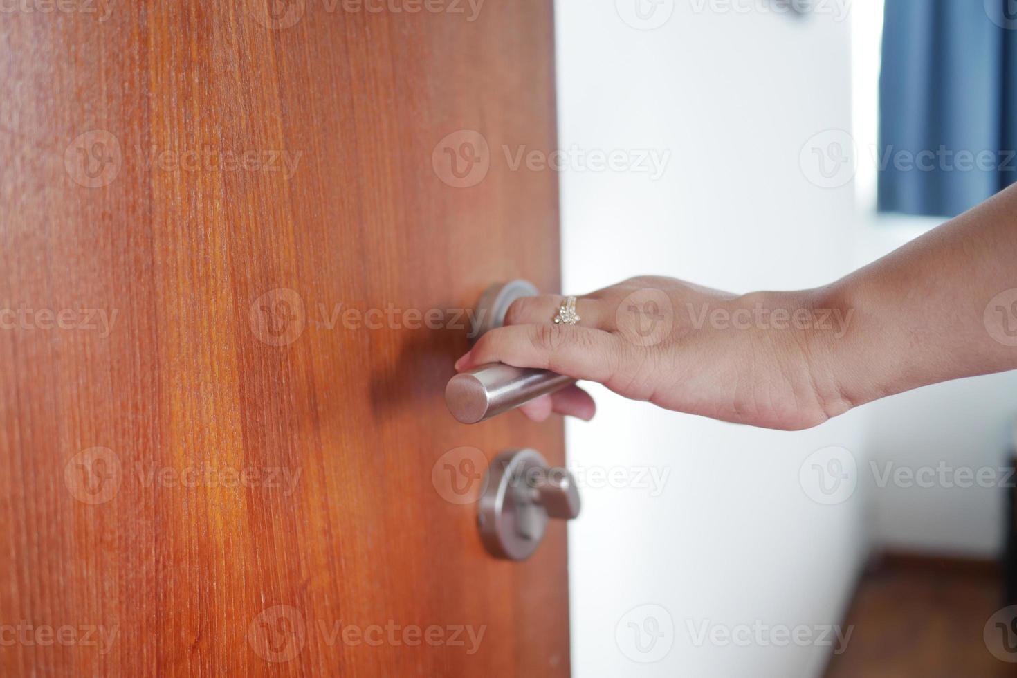 Man's Hand Opening door close up photo
