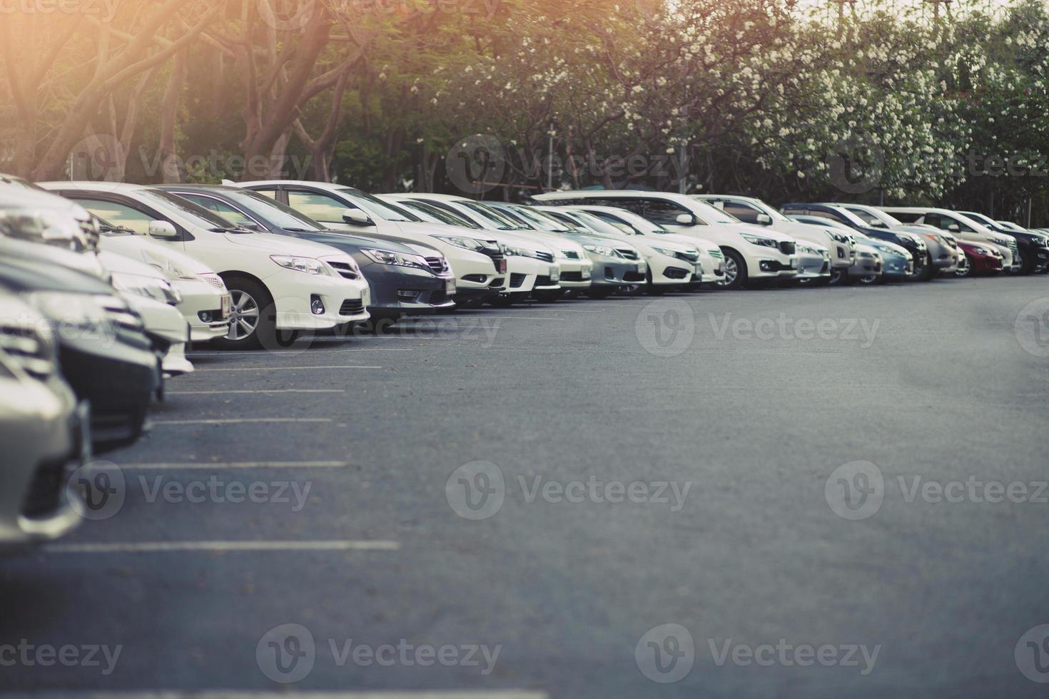 Cars parked in the parking lot.Open space area Outdoors. photo