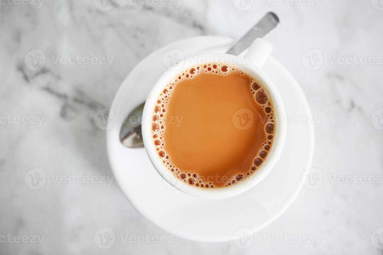 top view of cup of milk tea on table photo
