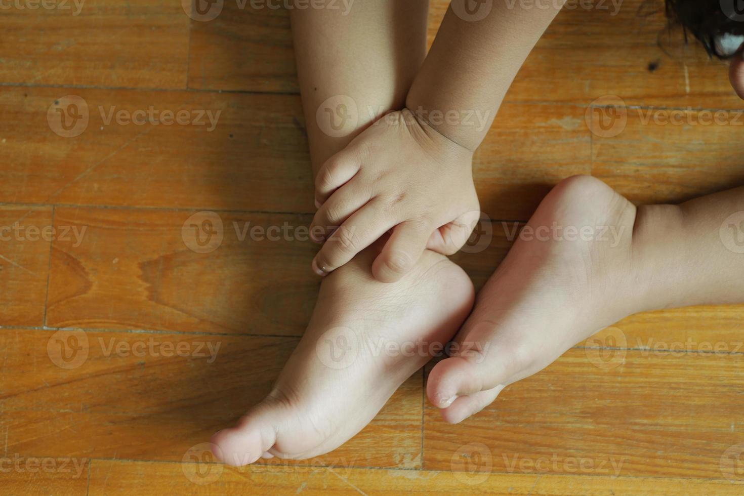 child girl suffering from itching skin, close up. photo