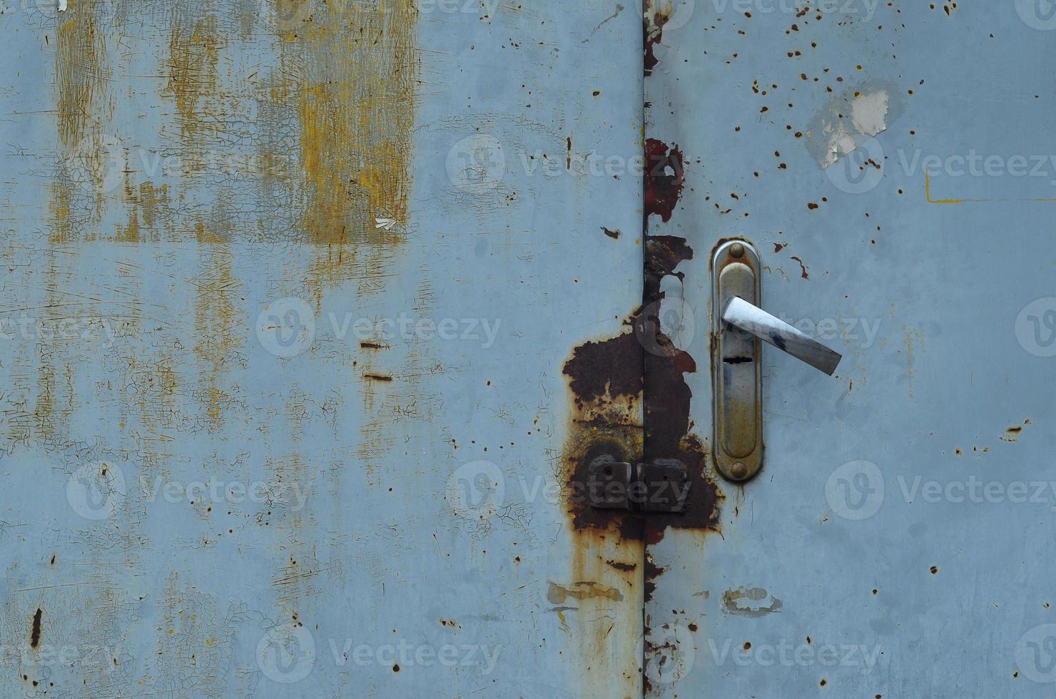 Metal surface from the outer old door with a lock photo