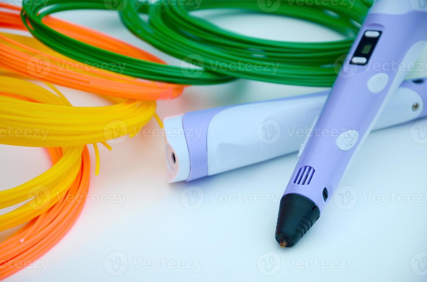 Top view on 3d pen and kit of colourful ABS plastic filament photo