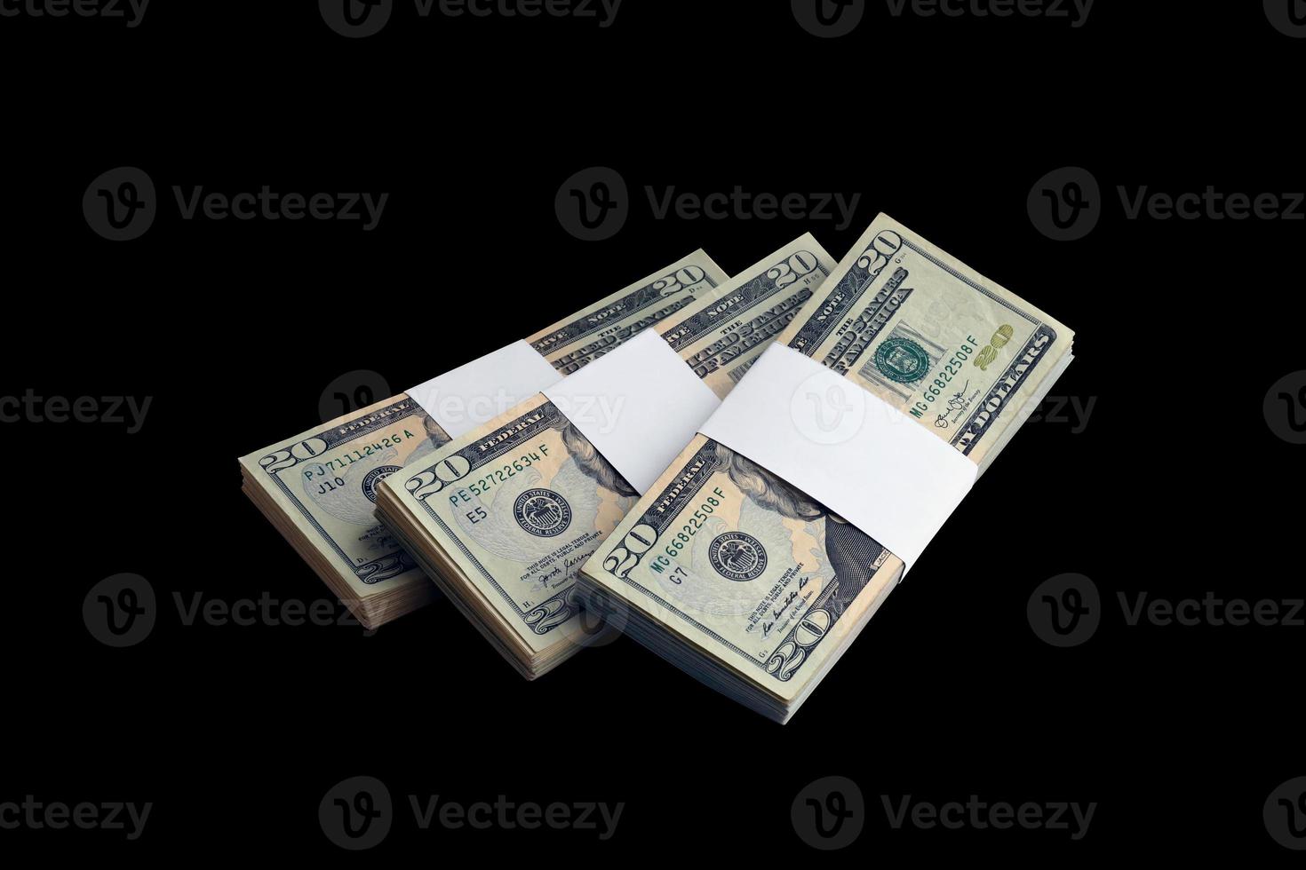 Bundle of US dollar bills isolated on black. Pack of american money with high resolution on perfect black background photo