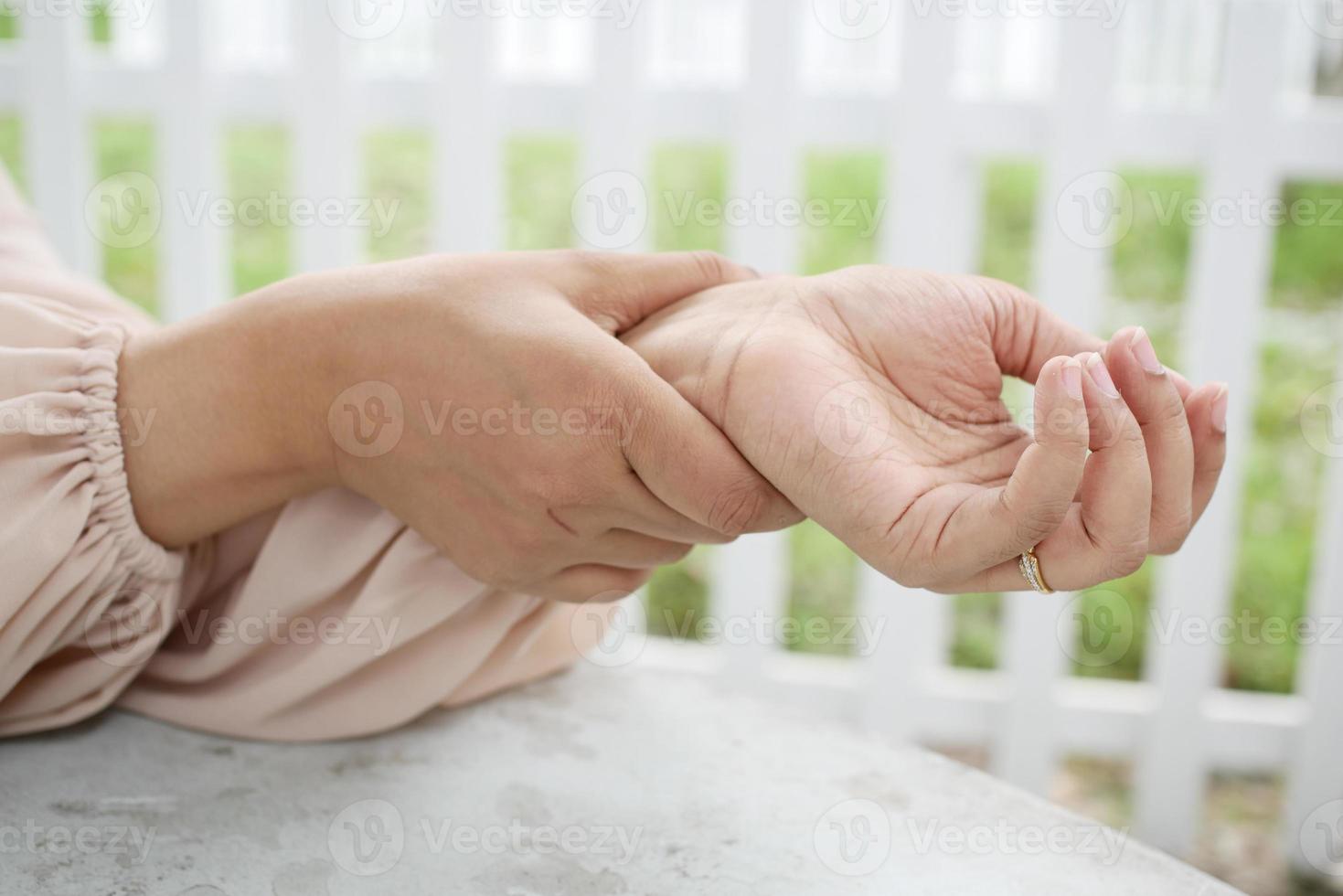 Young women hands suffering wrist pain photo