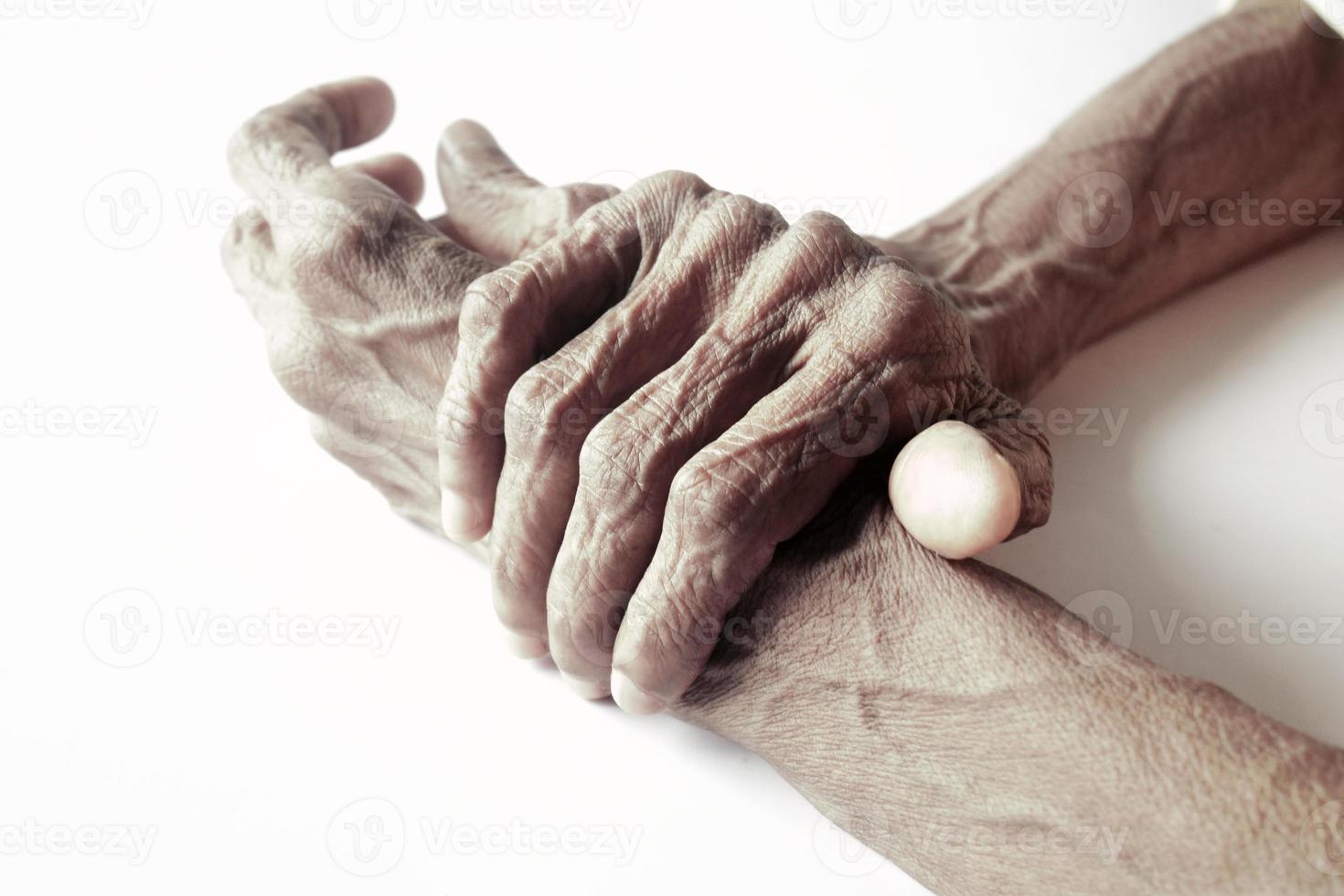 Elderly woman suffering from pain isolated on white photo