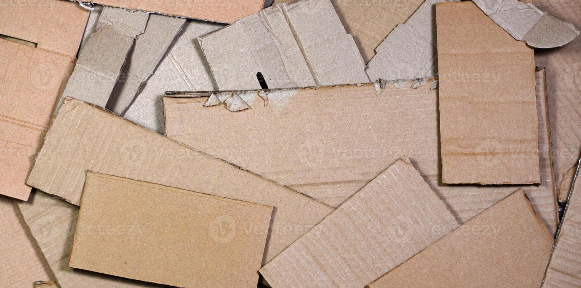 Background of paper textures piled ready to recycle. A pack of old office cardboard for recycling of waste paper. Pile of wastepaper photo