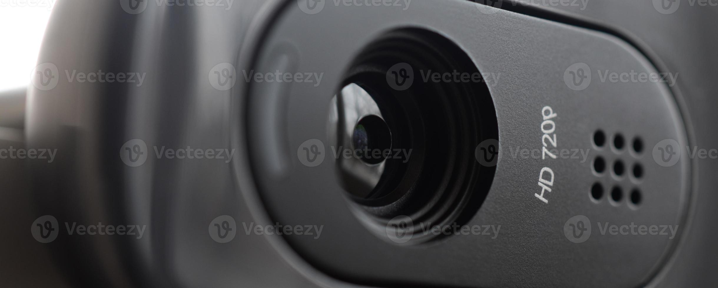 A modern web camera is installed on the body of a flat screen monitor. Device for video communication and recording of high quality video photo