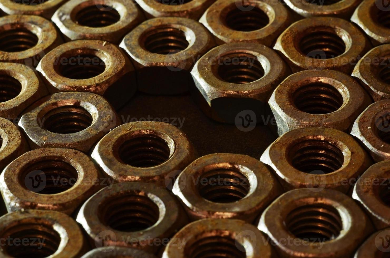 Close-up of rusty nuts photo