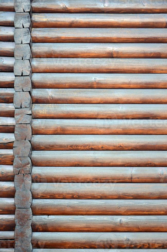 Hewn timber. Rustic log wall horizontal timber background photo
