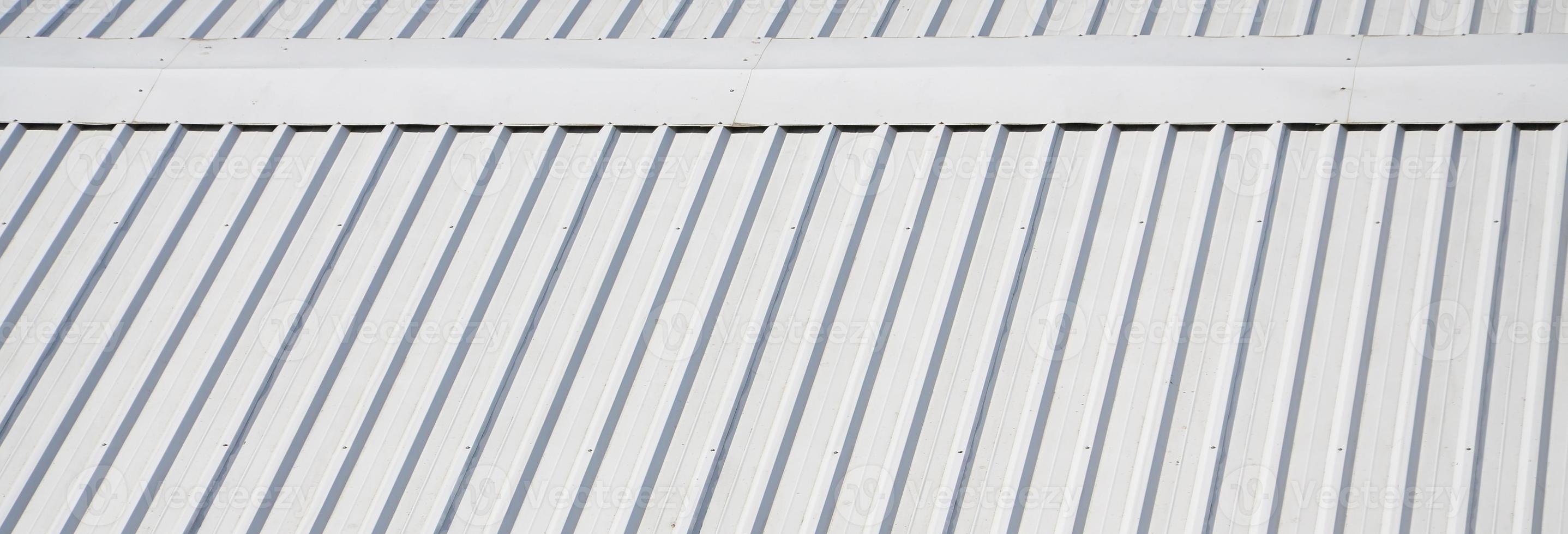 Metal gray roof with rhythmic parallel relief directions photo