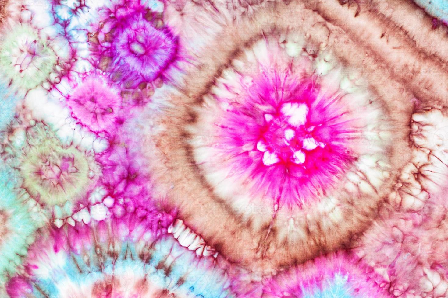 fragment of bright ornament in tie-dye batik photo