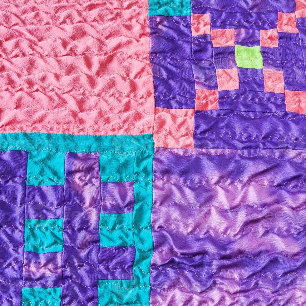 sewn pieces of fabrics in stitched silk patchwork photo