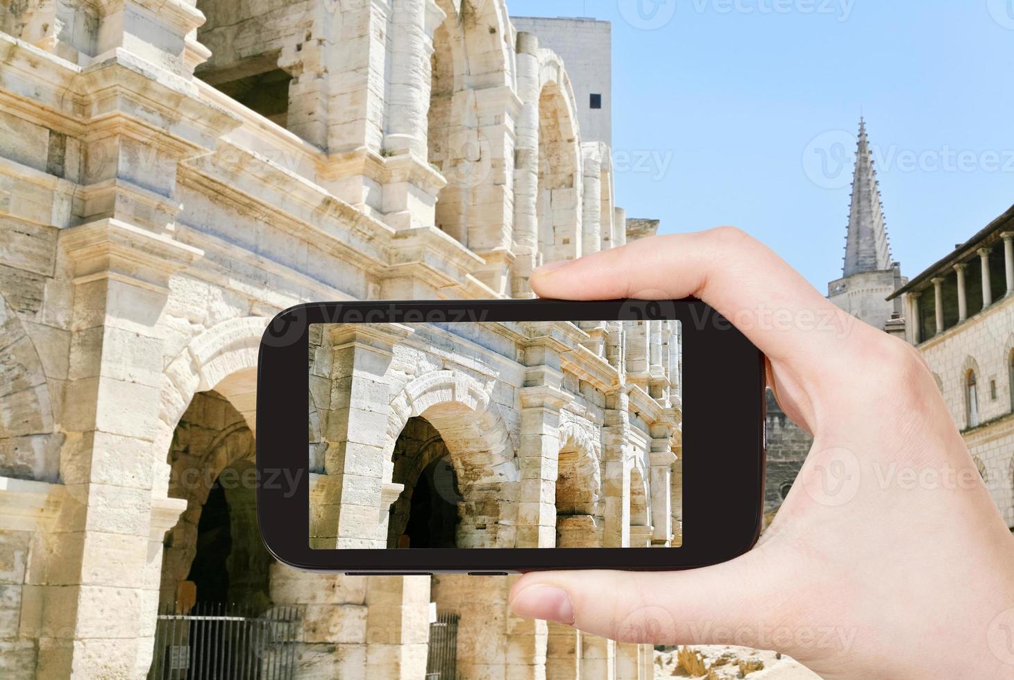 tourist taking photo of Arles Amphitheatre