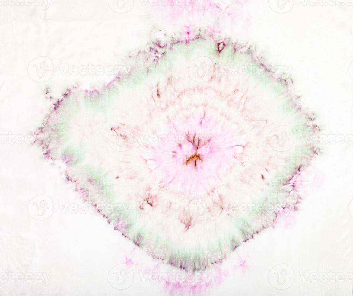 pattern in tie-dye batik technique on white silk photo
