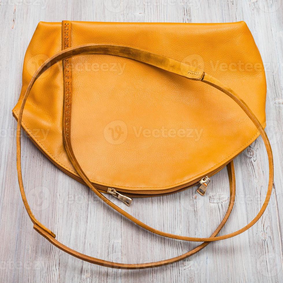 back side of handmade yellow leather bag photo