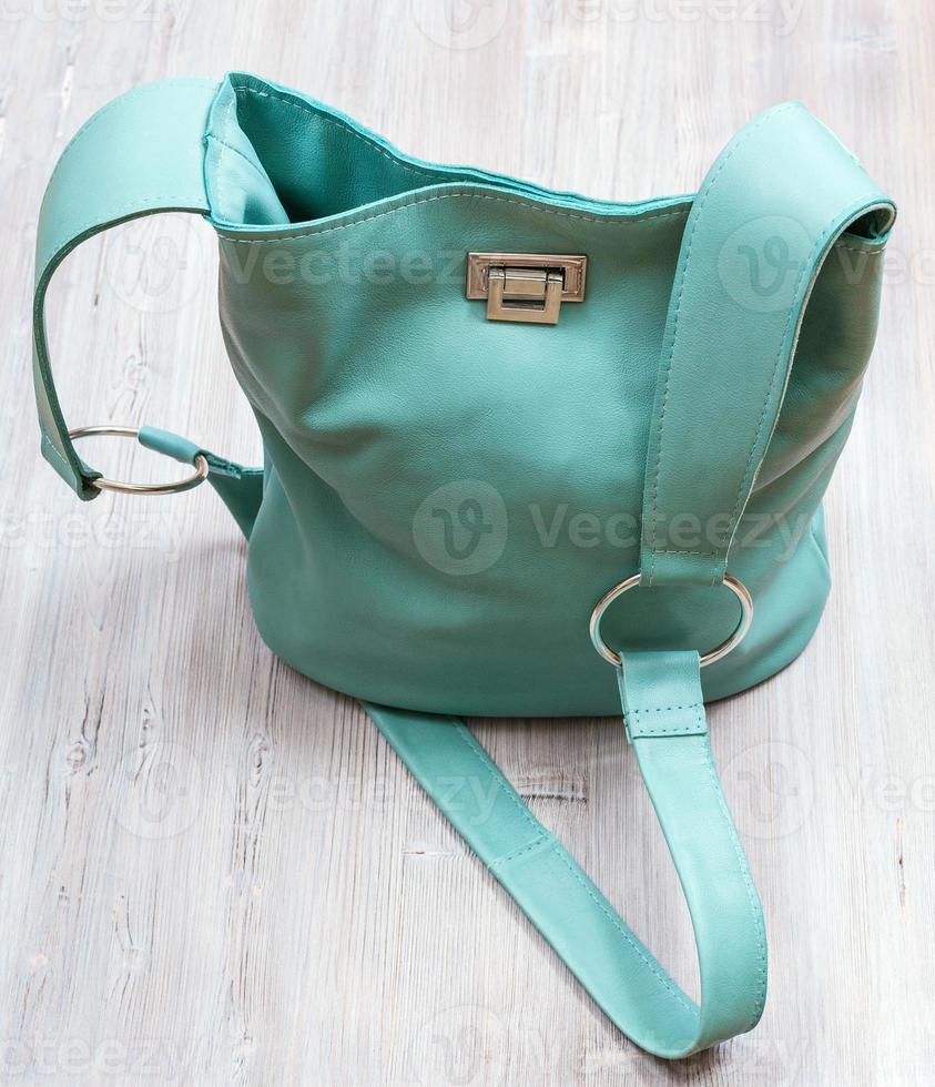 above view of turquoise colour leather handbag photo