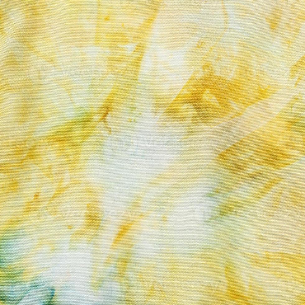 abstract yellow colored silk batik photo