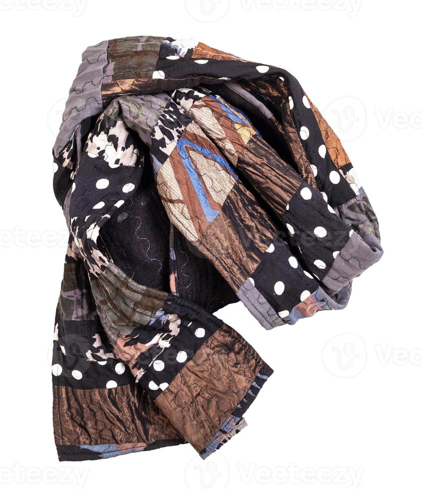 wrapped handmade brown patchwork scarf isolated photo